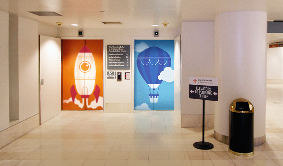 Dignity Health pediatric hospital elevator illustrations featuring rocket and hot air balloon