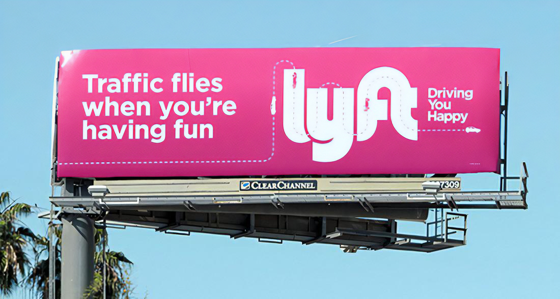 Lyft billboard advertisement in Los Angeles featuring Driving You Happy campaign