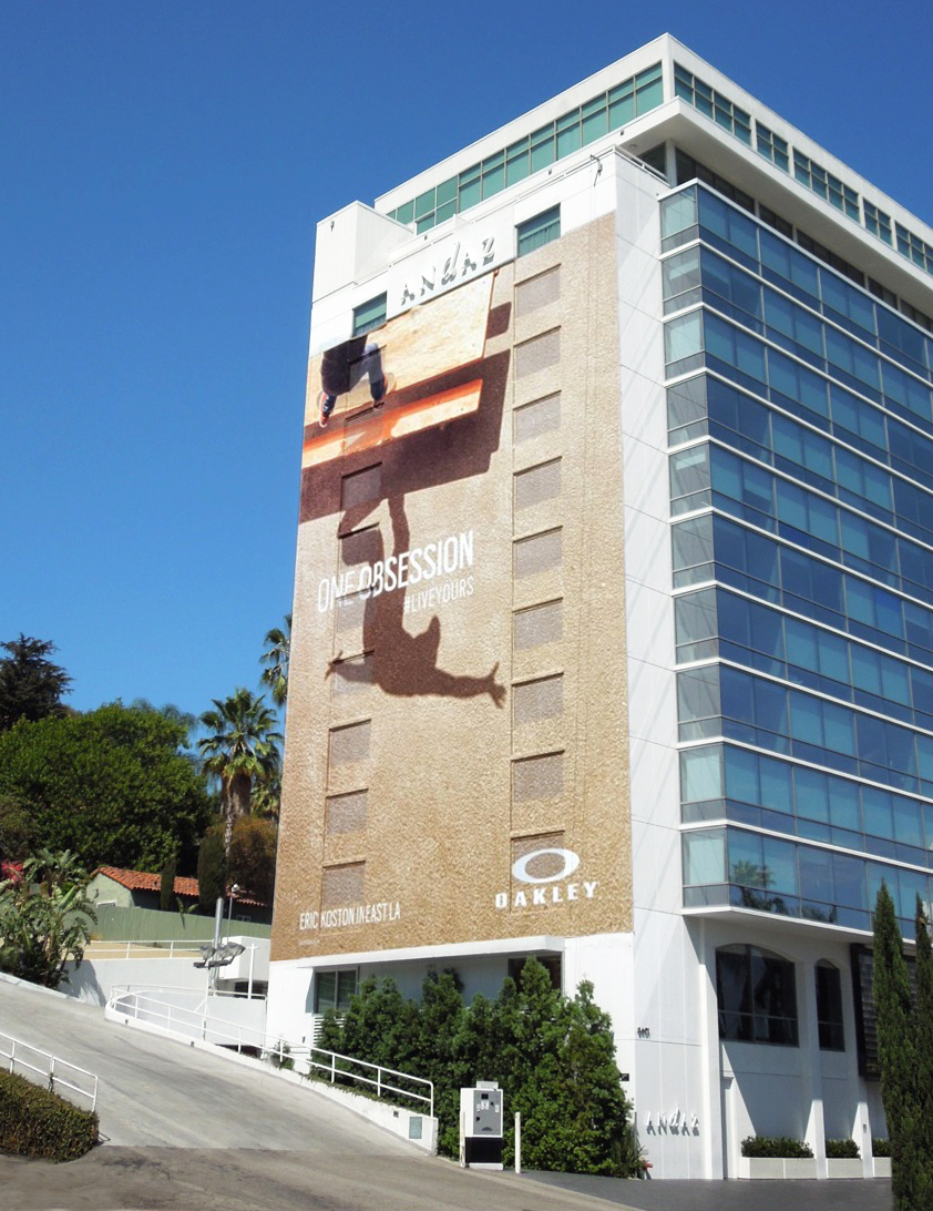 Large-scale Oakley ‘One Obsession’ billboard featuring skateboarder Eric Koston displayed on the side of the Andaz West Hollywood hotel in Los Angeles